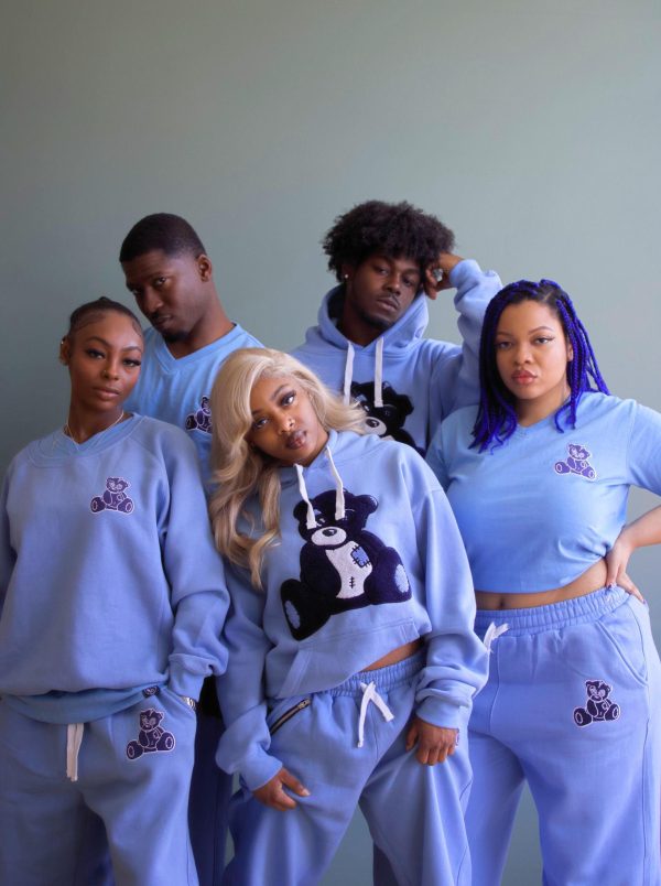 Models wear blue t-shirts, crewneck sweatshirts hoodies