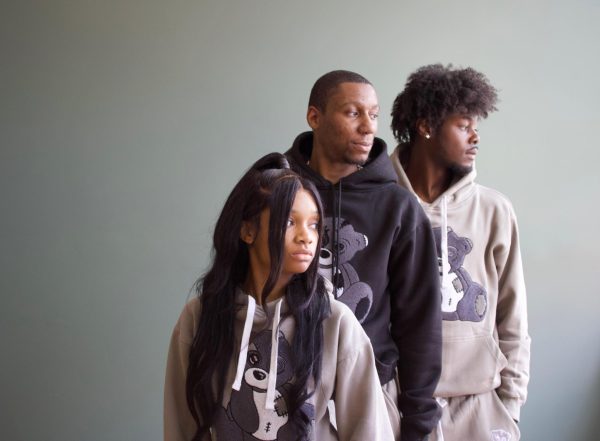 models wearing grey hoodies with teddy bears